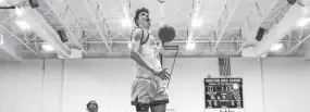  ?? JOE RONDONE/THE COMMERCIAL APPEAL ?? Houston's Mason Miller dunks the ball on a fast break against Arlington during a game at Houston High School on Jan. 29, 2021.