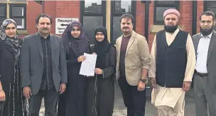  ??  ?? ●●Pupils, parents and trustees from Rochdale Islamic Academy following the school’s good Ofsted rating