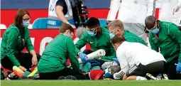  ??  ?? Alarming: Eric Bailly is strapped on to a stretcher by medics after two first-half blows to the head GETTY IMAGES