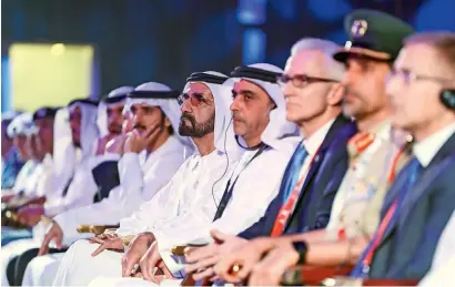  ?? — Wam ?? Sheikh Mohammed, Lt-General Sheikh Saif and other officials at the 87th Interpol General Assembly in Dubai on Sunday.