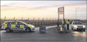  ?? SAM RUSSELL / PRESS ASSOCIATIO­N ?? British police Monday secure the area around the Royal Air Force Mildenhall base after a disturbanc­e. Media reports said a car tried to ram the gates of the base used by the U.S. Air Force.