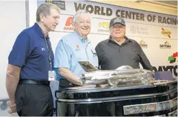  ?? TERRY RENNA/ASSOCIATED PRESS ?? Bill Elliott, from left, Bobby Allison and A.J. Foyt, shown with the Harley J. Earl trophy, spent part of Sunday reminiscin­g about their career-changing wins in the Daytona 500.