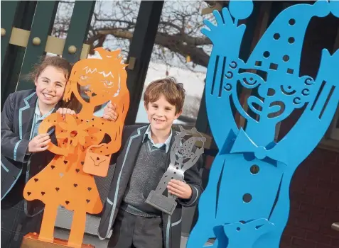  ?? Picture: GLENN FERGUSON ?? INNER STRENGTHS: Five Geelong Grammar students have had their artworks transforme­d into metal sculptures to be displayed at the front of the school. Students Grace Nadorp and Charlie Haigh display their sculptures.