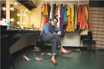  ?? Photos by Liz Hafalia / The Chronicle ?? Arjun Bhasin takes a break with some of his costumes for “Monsoon Wedding” at Berkeley Rep.