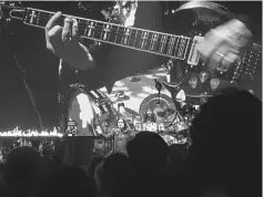  ?? — Photo Credit The New York Times ?? Black Sabbath, in a farewell concert at the Genting Arena in Birmingham, England, on Saturday. The band featured Ozzy Osbourne on vocals, Tony Iommi on guitar, Geezer Butler on bass and Tommy Clufetos on drums.