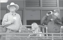  ?? ANTHONY GRUPPUSO/ USA TODAY ?? California Chrome co-owner Steve Coburn, left, and trainer Art Sherman view their horse’s workout in advance of the 2014 Belmont Stakes. California Chrome finished fourth.