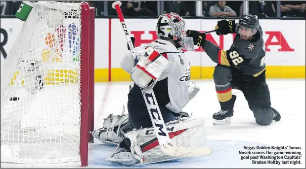  ?? GETTY IMAGES ?? Vegas Golden Knights’ Tomas Nosek scores the game-winning goal past Washington Capitals’ Braden Holtby last night.