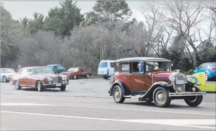 ??  ?? Some of the fleet leave for Pahiatua led by Graham Cheer of Norsewood in his 1930 Model A Ford followed by a 1974 RollsRoyce Silver Shadow.