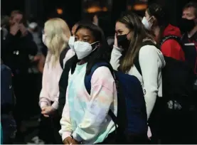  ??  ?? Simone Biles and the U.S. Women's Gymnastics team arrive for the Tokyo