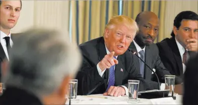  ?? EVAN VUCCI/ THE ASSOCIATED PRESS ?? President Donald Trump speaks Thursday during a meeting with manufactur­ing executives at the White House. With Trump, from left, are White House adviser Jared Kushner, Merck CEO Kenneth Frazier and Ford CEO Mark Fields.