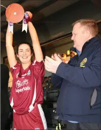  ??  ?? Katie O’Connor, the St. Martin’s captain, lifts the trophy.