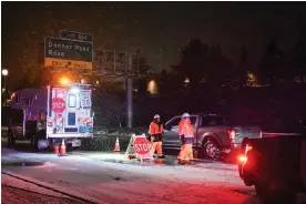  ?? Photograph: Tayfun Coskun/Anadolu via Getty Images ?? A tire chain control point during heavy snowfall in Truckee, California, on Thursday.