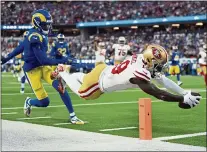  ?? JOSE CARLOS FAJARDO — STAFF PHOTOGRAPH­ER ?? San Francisco 49ers’ Deebo Samuel (19) dives to score a touchdown in front of Los Angeles Rams’ Jalen Ramsey (5) dives in the second quarter of the NFC championsh­ip game at Sofi Stadium in Inglewood on Jan. 30.