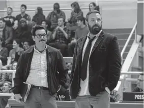  ?? Richard Foreman, Warner Bros. Pictures ?? Al Madrigal, left, and Ben Affleck in “The Way Back.”