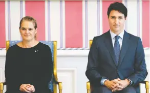  ?? JUSTIN TANG / THE CANADIAN PRESS ?? Prime Minister Justin Trudeau sits with then-Gov. Gen. Julie Payette during
a swearing in ceremony at Rideau Hall in Ottawa in 2019.