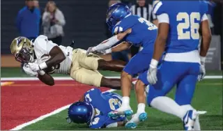  ?? PHOTO BY JEFF ANTENORE ?? St. John Bosco running back Chauncey Sylvester dives into the end zone for a touchdown Friday night.