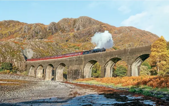  ?? SAM YEELES ?? LMS ‘Black Five’ No. 44871 meets the sea as it crosses Loch Nan Uamh viaduct on the West Highland Extension in the afternoon sun on October 25.