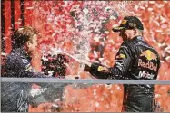  ?? Dan Mullan / Getty Images ?? Race winner Max Verstappen of Oracle Red Bull Racing celebrates on the podium during the F1 Grand Prix of Canada on Sunday at Circuit Gilles Villeneuve in Montreal.