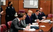  ?? SETH WENIG — THE ASSOCIATED PRESS ?? Former President Donald Trump, center, appears in court for his arraignmen­t April 4, 2023, in New York.