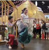  ??  ?? Filipino dancers in national costumes perform at the 14th China-ASEAN Expo in Nanning, Guangxi, Sept. 15, 2017.