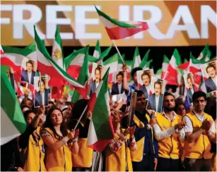  ?? (Regis Duvignau/Reuters) ?? SUPPORTERS OF the National Council of Resistance of Iran attend the June 30 rally in Villepinte, near Paris.