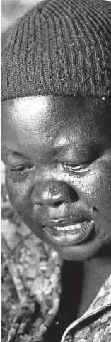  ?? Pictures: © Alex Art Centre and © M Zungu ?? ‘BREAKDOWN’ TREATMENT Child activist Stompie Seipei, left, and his mother, Joyce Seipei, after his death in 1989.