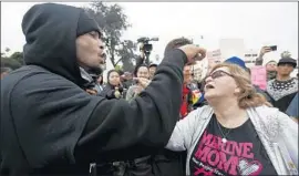  ?? Luis Sinco Los Angeles Times ?? A TRUMP-inspired protest at Beverly Gardens Park leads to testy exchanges.