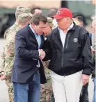  ?? HENRY TAYLOR/THE TENNESSEAN ?? Republican Senate candidate and former U.S. Ambassador to Japan
Bill Hagerty shakes hands with President Donald Trump as he arrives at Berry Field Air National Guard Base in Nashville on March 6.