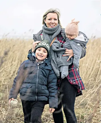  ??  ?? Happy family: Sara Flyckt and children Mio, five, and Macy, eight months, near their home in southern Sweden