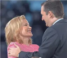  ?? PAUL J. RICHARDS, AFP/GETTY IMAGES ?? Sen. Ted Cruz embraces his wife, Heidi, on March 23, 2015, after announcing his candidacy for president.