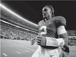  ?? Kevin C. Cox / Getty Images ?? Jalen Hurts leaves behind a legacy at Alabama that includes helping the Crimson Tide reach the national championsh­ip game three times, with a victory after the 2017 season.