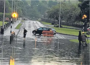  ??  ?? The sudden and heavy downpour brought floods to parts of Fife, while it gave photograph­er Dylan Drummond the chance to capture this dramatic image of lightning over the Tay.