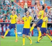  ?? REUTERS ?? Sweden's Albin Ekdal, Gustav Svensson and Mikael Lustig celebrate thumping Mexico 30 at Ekaterinbu­rg Arena.