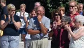  ?? DIGITAL FIRST MEDIA FILE PHOTO ?? Lansdale Parks and Recreation Director Carl Saldutti, center, is applauded by friends and family as Saldutti was given the group’s Lansdale Lifetime Achievemen­t Award in August 2013.