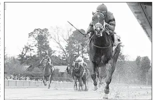  ?? Photo courtesy of Oaklawn Park ?? Swing and Sway with David Cabrera aboard comes down the stretch to win the American Beauty Stakes on Saturday at Oaklawn Park in Hot Springs. Swing and Sway won the 6-furlong race in 1:10.68 by 73/ lengths over Summer House. 4