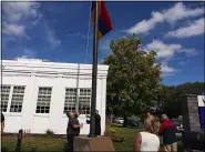  ?? MEDIANEWS GROUP ?? The Armenian flag is raised onto the flagpole in front of city hall, where it will remain for the week.