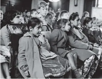  ??  ?? Children at a meeting to demand a playground in Bethnal Green, London, 1962