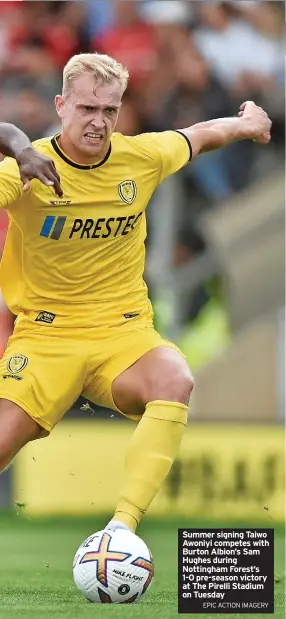  ?? EPIC ACTION IMAGERY ?? Summer signing Taiwo Awoniyi competes with Burton Albion’s Sam Hughes during Nottingham Forest’s 1-0 pre-season victory at The Pirelli Stadium on Tuesday