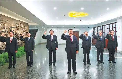  ?? LAN HONGGUANG / XINHUA ?? Xi Jinping, general secretary of the Communist Party of China Central Committee, leads the other six members of the Standing Committee of the Political Bureau of the CPC Central Committee in reciting the admission oath as they face the Party flag on...