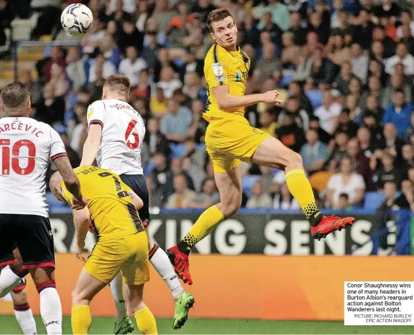  ?? PICTURE: RICHARD BURLEY/ EPIC ACTION IMAGERY ?? Conor Shaughness­y wins one of many headers in Burton Albion’s rearguard action against Bolton Wanderers last night.