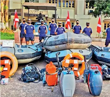  ?? - PTI ?? Rescuers ready their gear for rescue and relief operations as a low-pressure area in the North Andaman seas that may intensify into a cyclone heads towards Odisha and West Bengal, on Saturday.