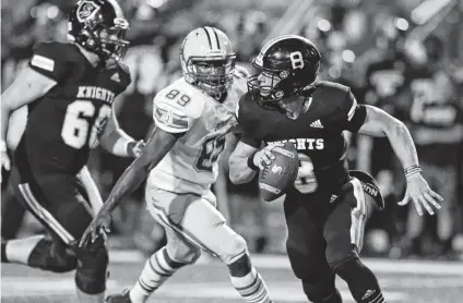  ?? Photos by Tom Reel / Staff photograph­er ?? Steele quarterbac­k Wyatt Begeal is forced out of the backfield by Judson defensive lineman Dajuan Carmichael in Friday night’s game at Lehnhoff Stadium. Judson’s Michael Chandler II scored with less than a minute left to lift the Rockets to a 51-48 win.