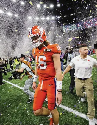  ?? GERALD HERBERT / ASSOCIATED PRESS ?? Clemson quarterbac­k Trevor Lawrence leaves the field after losing to LSU 42-25 in the national title game Jan. 13. “It makes you want to work even harder to get back there,” he says.