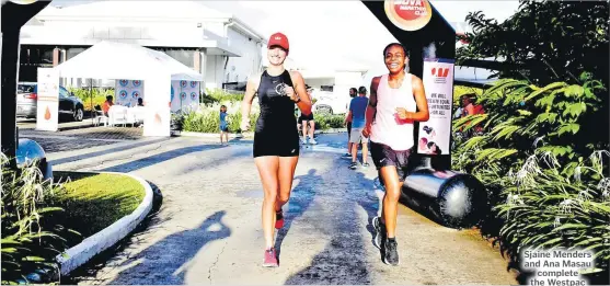  ?? Picture: JONA KONATACI ?? Sjaine Menders and Ana Masau complete the Westpac Internatio­nal Women’s Day walk at Grand Pacific Hotel carpark in Suva yesterday.