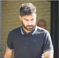  ?? CP PHOTO ?? Truck driver Jaskirat Sidhu walks out of provincial court after appearing for charges due to the Humboldt Broncos bus crash in Melfort, Sask., on Tuesday.