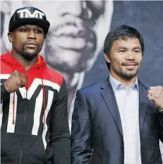  ?? JOHN LOCHER/ THE ASSOCIATED PRESS ?? Floyd Mayweather, left, and Manny Pacquiao will wage the richest fight in boxing history on Saturday in Las Vegas.