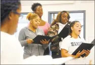  ??  ?? Members of the Harding High School choir rehearse in Bridgeport on Friday. Choir teacher Sheena Graham has been selected as a finalist for the 2019 Connecticu­t Teacher of the Year.