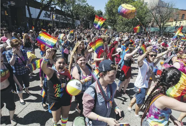  ?? CODIE MCLACHLAN/FILES ?? Crowds gather during the 2016 Edmonton Pride Festival parade in Old Strathcona. The theme of this year’s festival is “one Pride, many voices.”