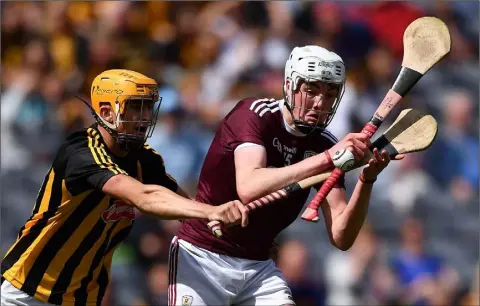  ??  ?? Greg Thomas of Galway and Kilkenny’s William Halpin in action during last year’s All-Ireland Minor hurling final. Tom is a firm advocate of restoring the age limit for this grade to the former Under-18, rather than Under-17 as it stands at present.