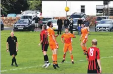  ?? 01_b39footy03 ?? Ryan Armstrong jumps highest to head the ball in the middle of the park.